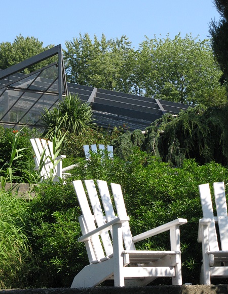 Adirondack chairs, beneath glasshouse, Botanical Gardens, Hamburg, Germany