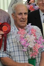 Keith-Thompson-and-his-winning sweet peas in Mr Fothergill's competition 2014