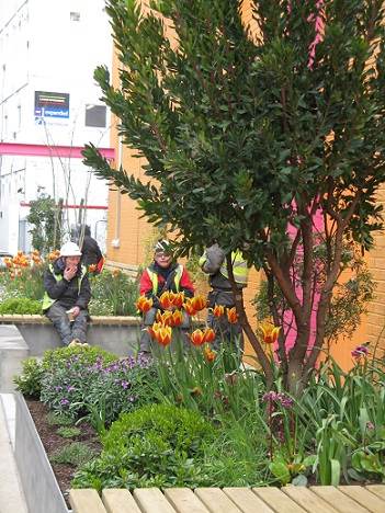 Workmen taking a break in the Greenwood Theatre Pocket Park