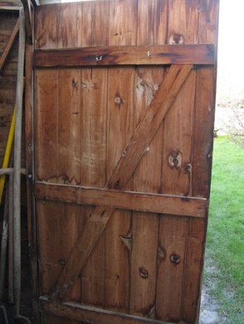 Wooden shed door with cross bracing