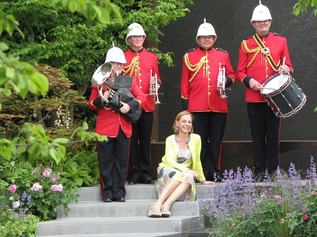 Jo Thompson with a military band in her Chelsea Barracks Garden.